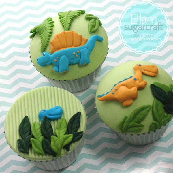 Dinosaur cupcakes with jungle leaves